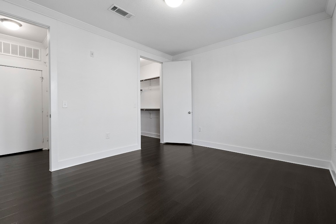 3300 Towers Boulevard, Unit 958 Seabrook, TX 77586 - Photo 9 of 33 a view of an empty room with wooden floor