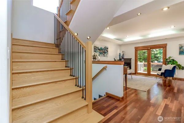 a view of entryway and hall with wooden floor