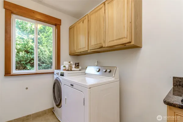 a utility room with dryer and washer