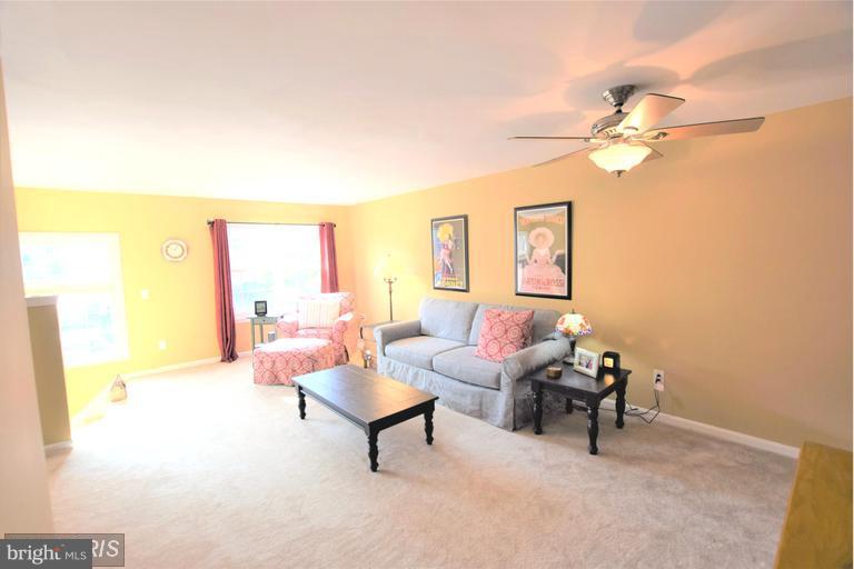 403 McDaniel Drive Purcellville, VA 20132 - Photo 5 of 13 a living room with furniture a rug and a window