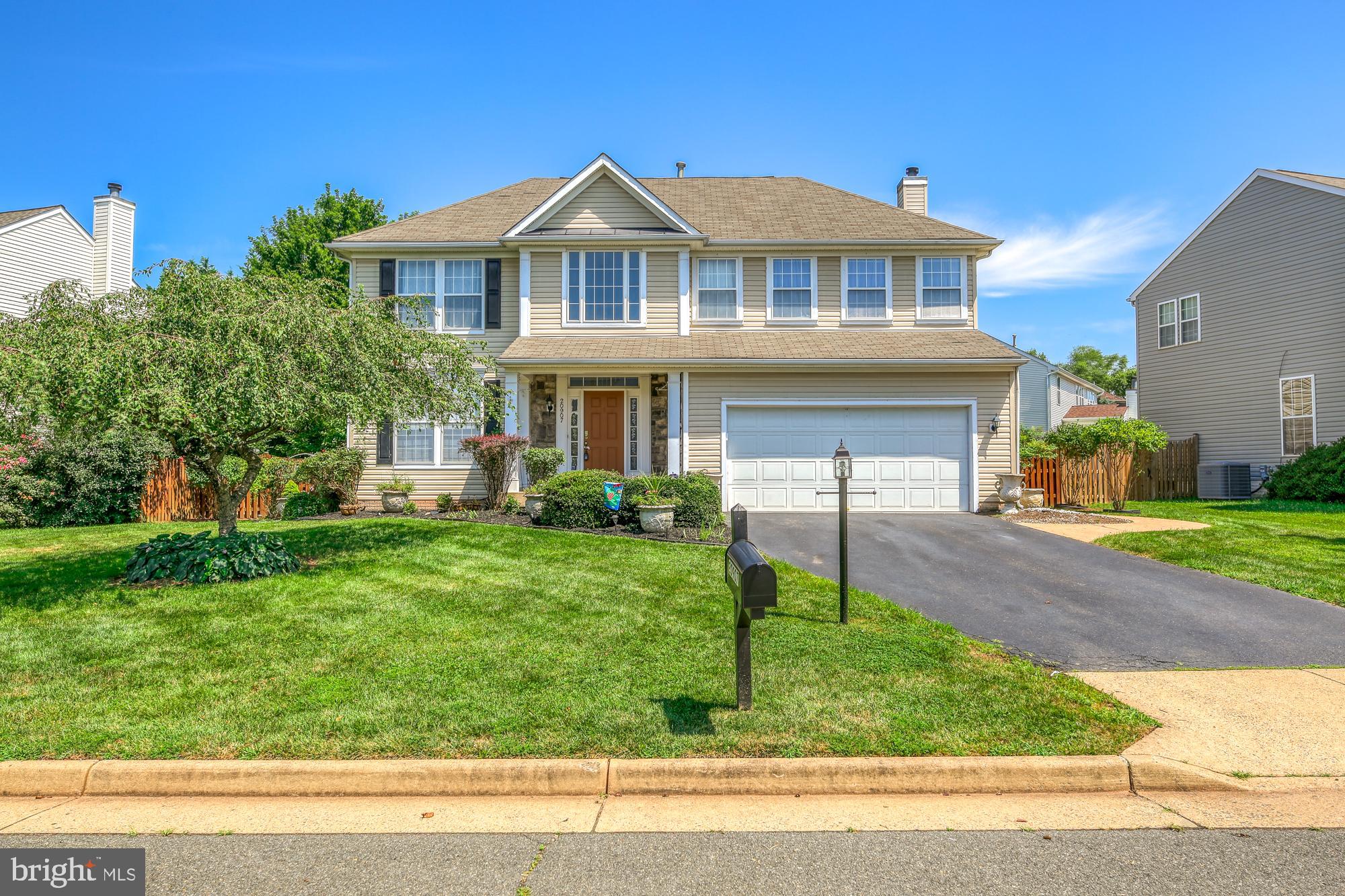 20907 Chippoaks Forest Circle Sterling, VA 20165 - Photo 1 of 71 a front view of a house with a yard