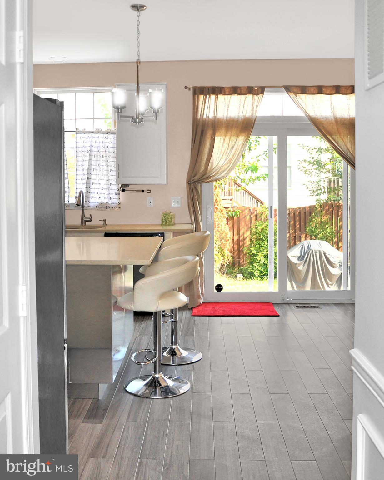 20907 Chippoaks Forest Circle Sterling, VA 20165 - Photo 15 of 71 a view of a room with wooden floor and windows