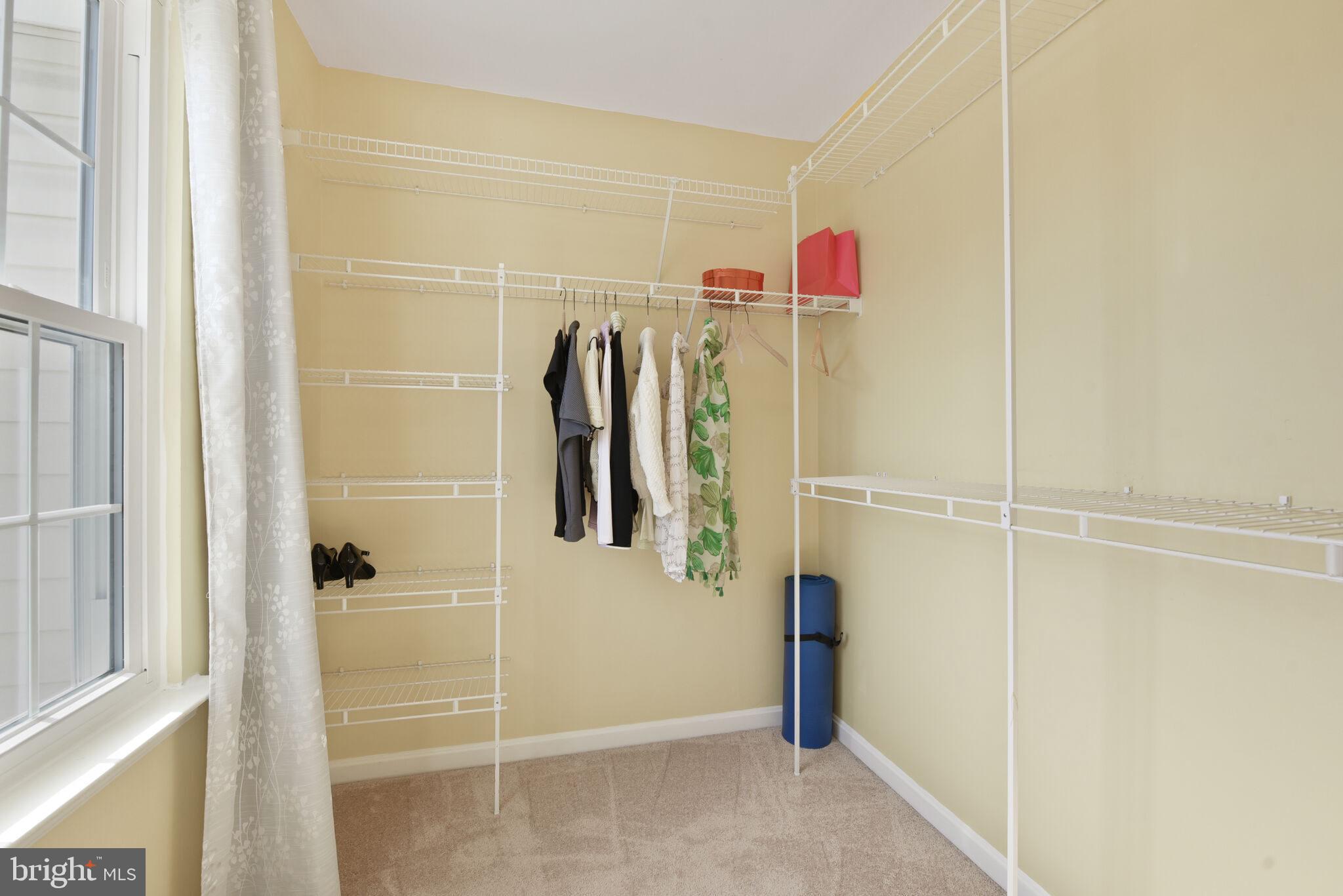 20907 Chippoaks Forest Circle Sterling, VA 20165 - Photo 28 of 71 a view of walk in closet with clothes