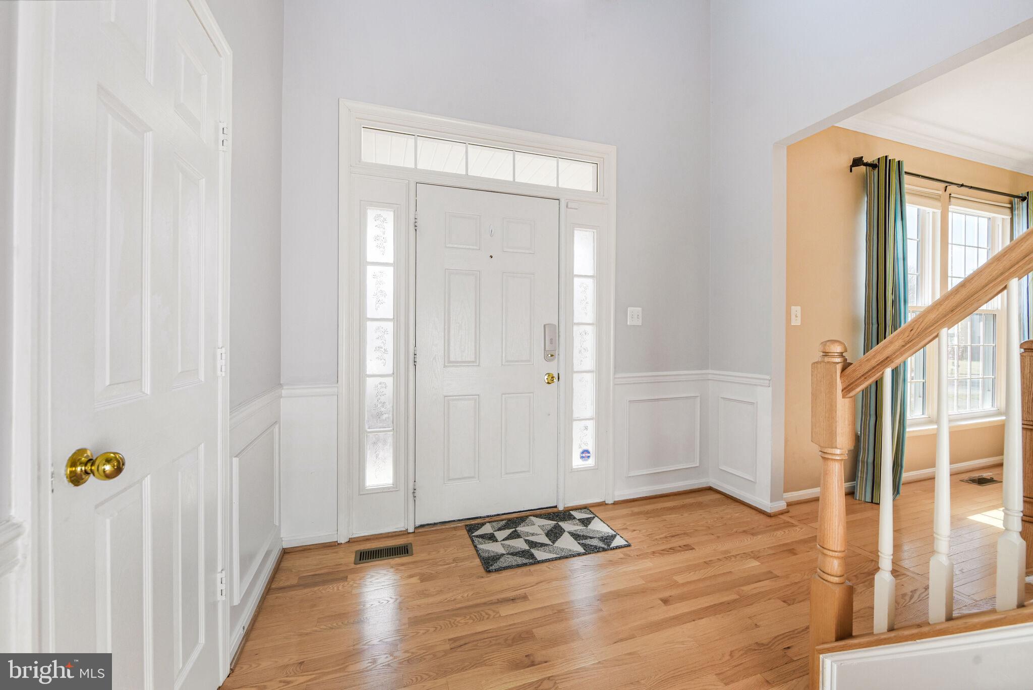20907 Chippoaks Forest Circle Sterling, VA 20165 - Photo 3 of 71 a view of an entryway with wooden floor