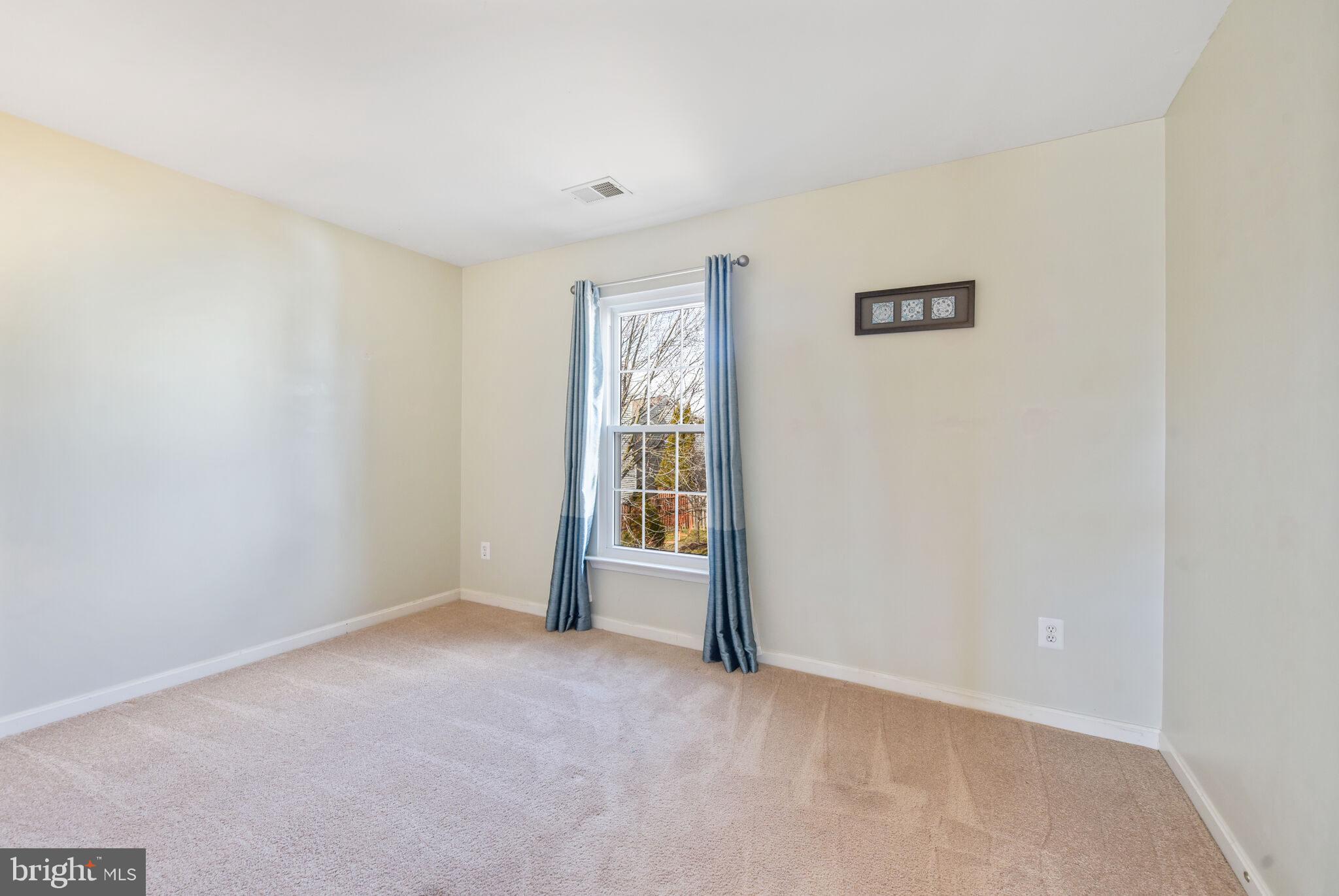 20907 Chippoaks Forest Circle Sterling, VA 20165 - Photo 32 of 71 a view of an empty room with a window