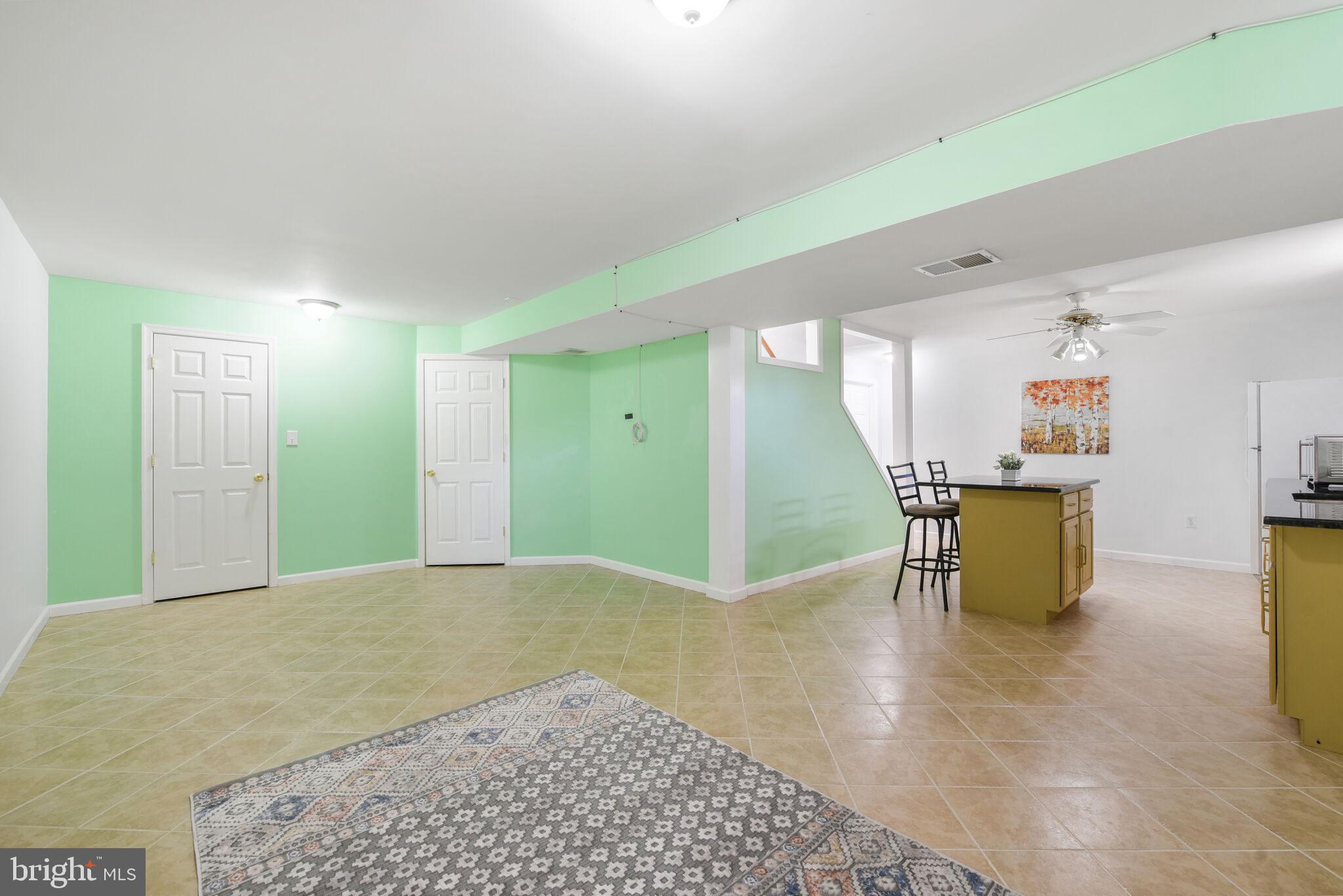 20907 Chippoaks Forest Circle Sterling, VA 20165 - Photo 42 of 71 a view of an empty room with a kitchen