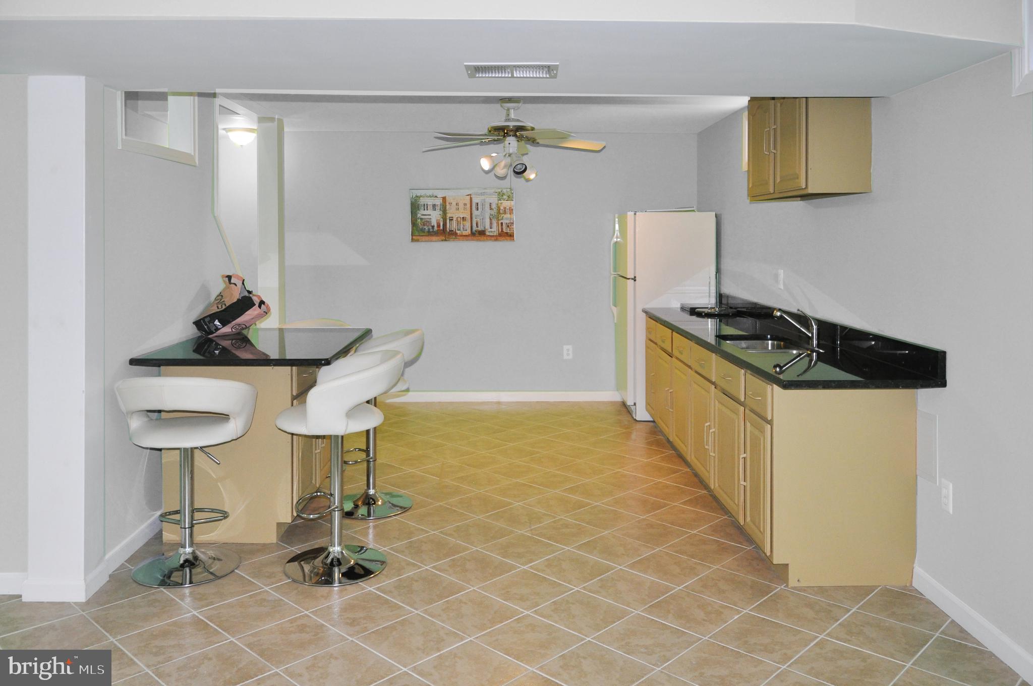 20907 Chippoaks Forest Circle Sterling, VA 20165 - Photo 44 of 71 a kitchen with a table and chairs in it