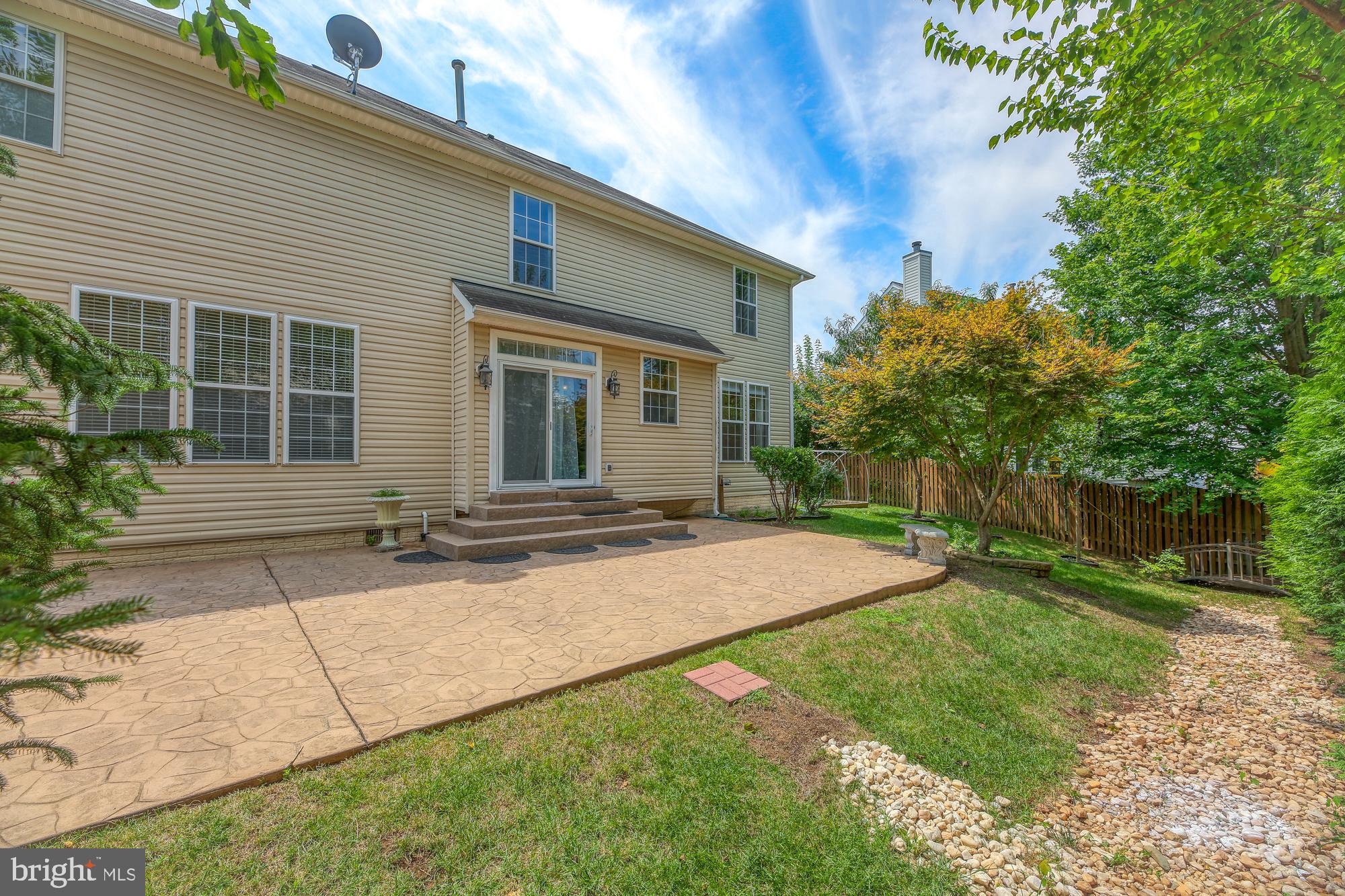 20907 Chippoaks Forest Circle Sterling, VA 20165 - Photo 53 of 71 a house view with a backyard space