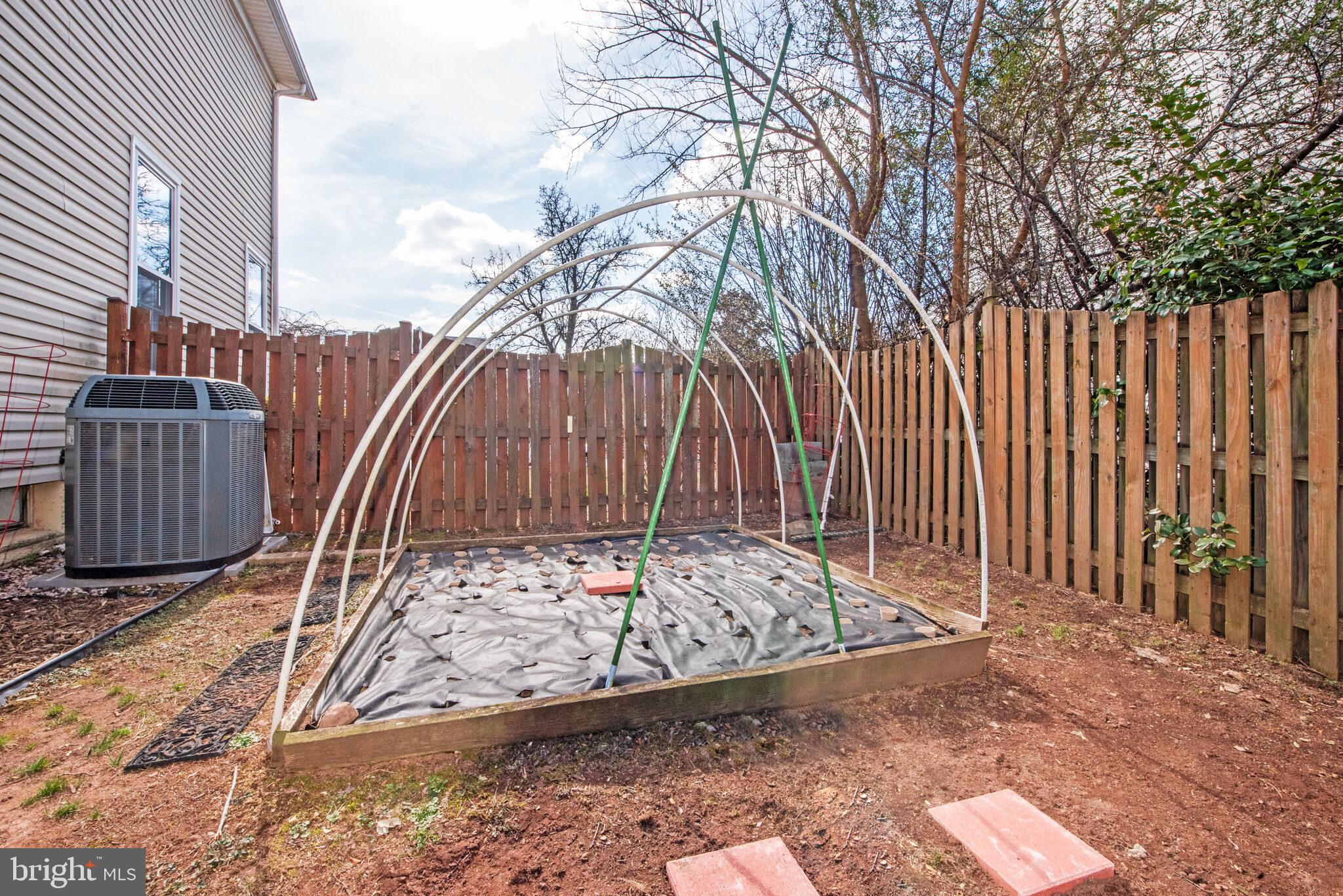 20907 Chippoaks Forest Circle Sterling, VA 20165 - Photo 56 of 71 a view of a backyard with wooden fence
