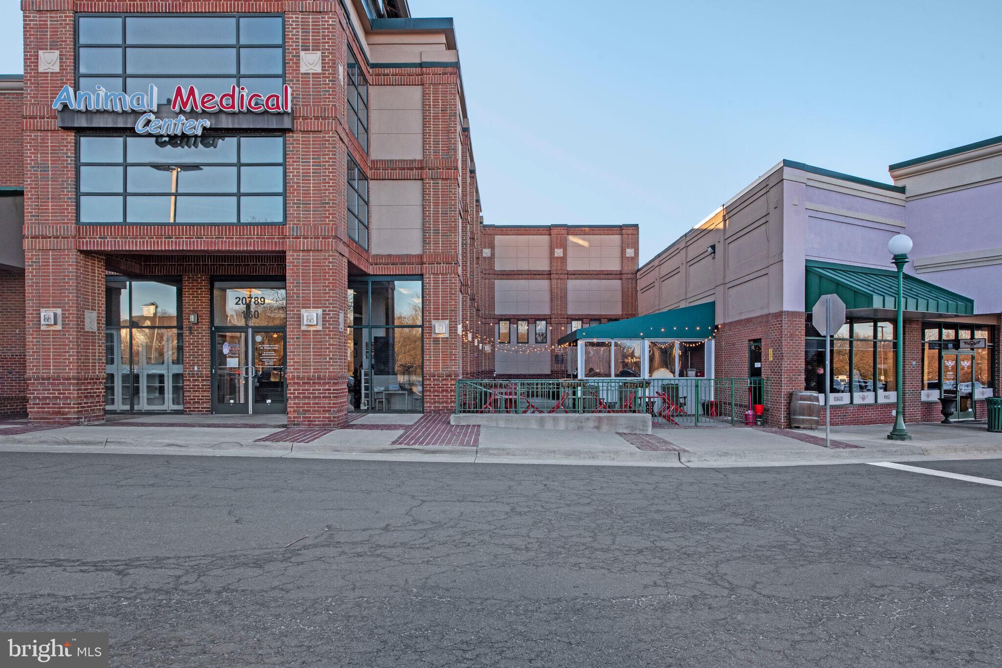 20907 Chippoaks Forest Circle Sterling, VA 20165 - Photo 71 of 71 a view of a street with stores