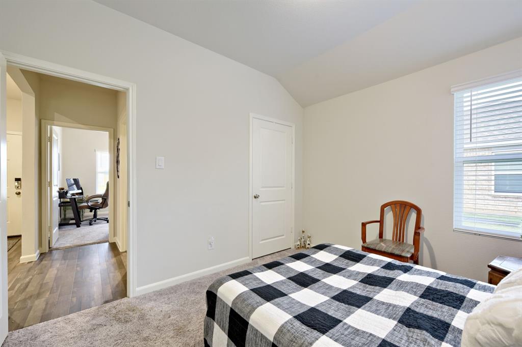 420 Jameson Springtown, TX 76082 - Photo 19 of 29 a bedroom with a bed and a wooden floor