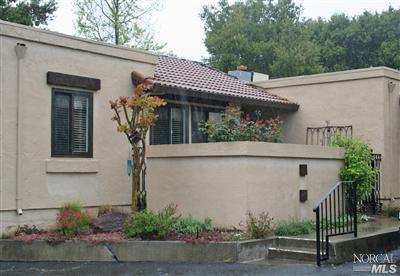 La Mancha Drive Sonoma, CA 95476 - Photo 1 of 9 a view of a white house with potted plants and a large tree