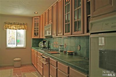 La Mancha Drive Sonoma, CA 95476 - Photo 6 of 9 a kitchen with stainless steel appliances a sink and cabinets