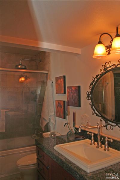 La Mancha Drive Sonoma, CA 95476 - Photo 7 of 9 a bathroom with a sink and a mirror