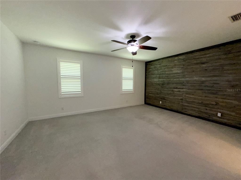 3775 Manorwood Loop Parrish, FL 34219 - Photo 12 of 30 a view of a livingroom with a ceiling fan and window