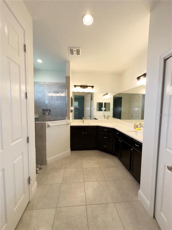 3775 Manorwood Loop Parrish, FL 34219 - Photo 14 of 30 a large white kitchen with a sink and cabinets