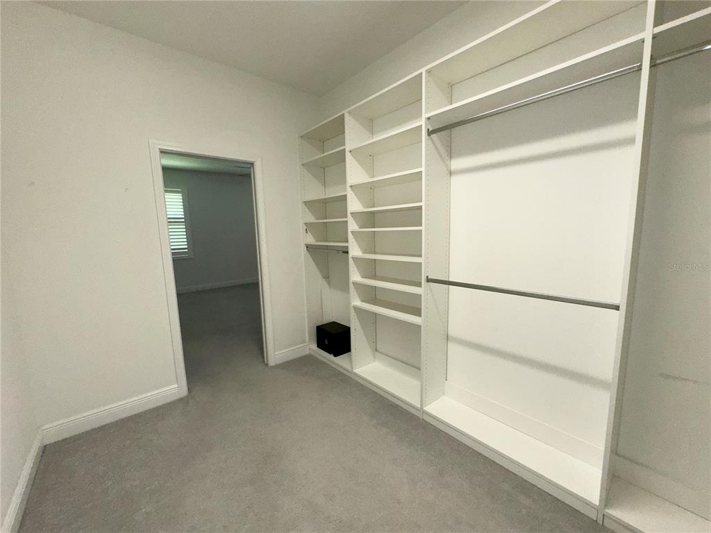 3775 Manorwood Loop Parrish, FL 34219 - Photo 19 of 30 a view of an empty room with a glass door