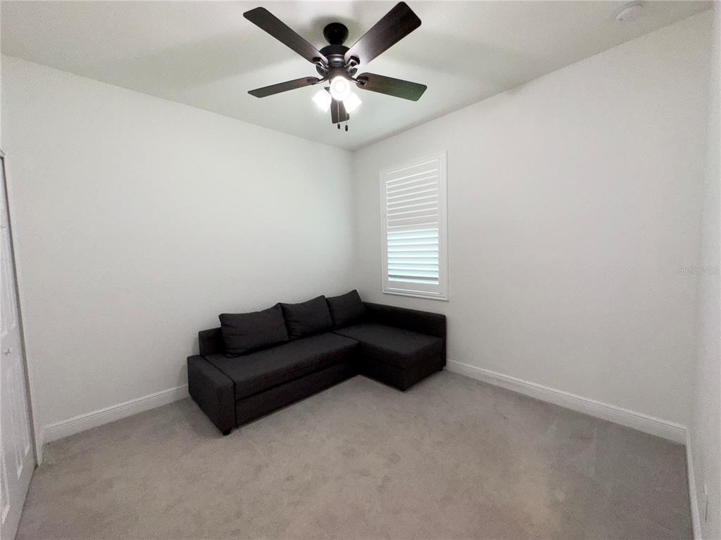 3775 Manorwood Loop Parrish, FL 34219 - Photo 20 of 30 a living room with furniture and a window
