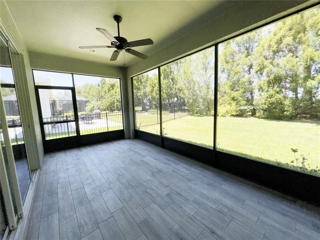 3775 Manorwood Loop Parrish, FL 34219 - Photo 28 of 30 a view of a room with wooden floor and city view