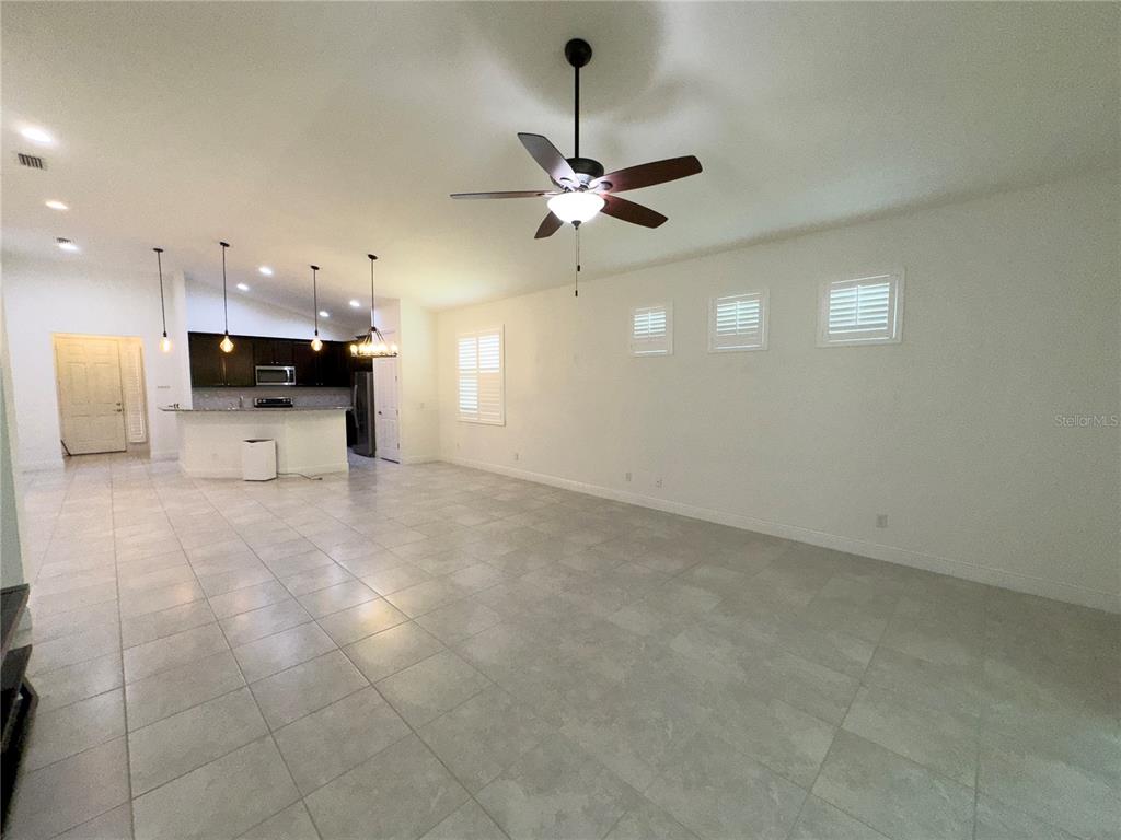 3775 Manorwood Loop Parrish, FL 34219 - Photo 6 of 30 a view of a kitchen with a stove cabinets and furniture