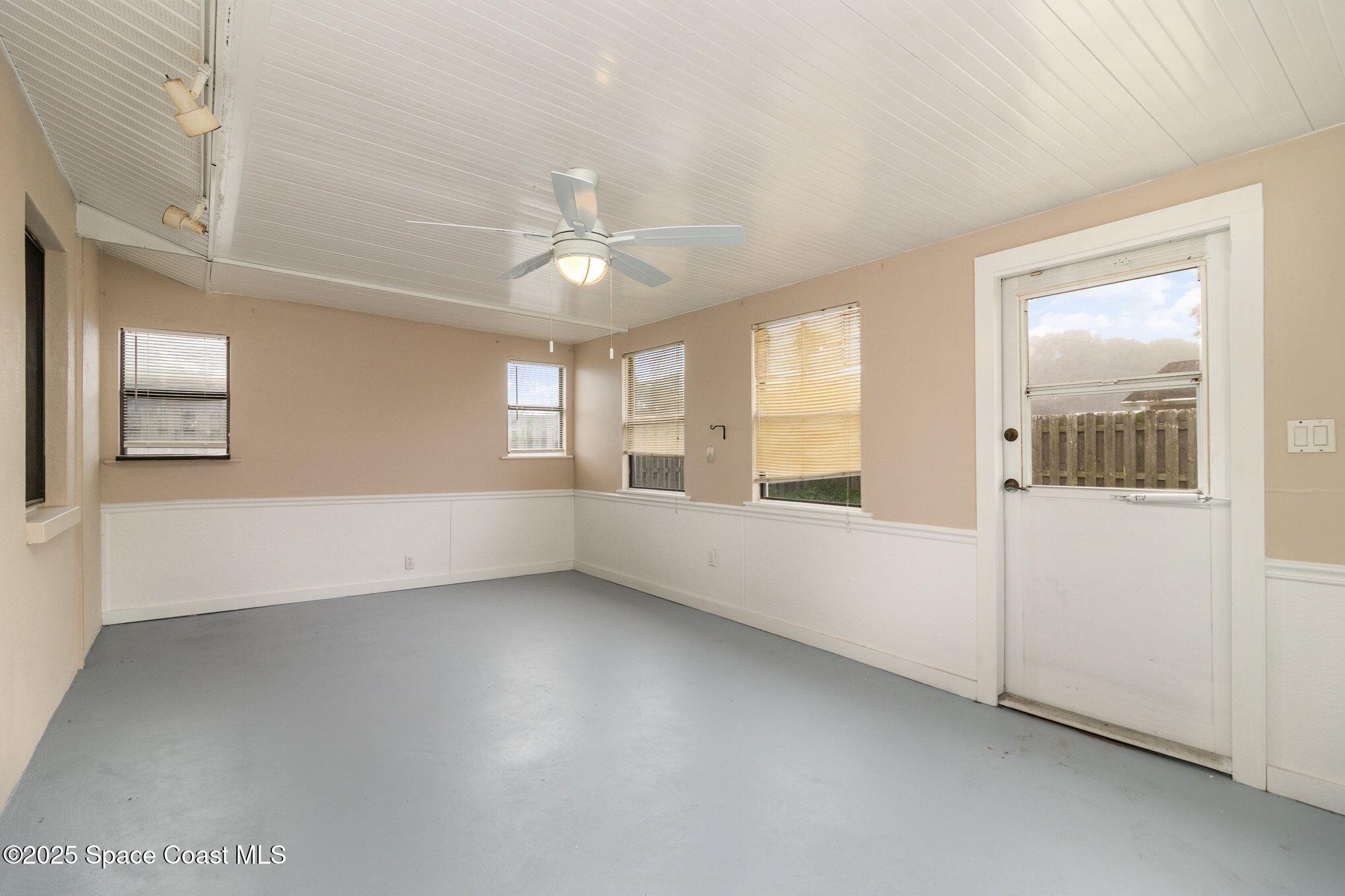 2863 Corbusier Drive Melbourne, FL 32935 - Photo 17 of 20 a view of an empty room with a window