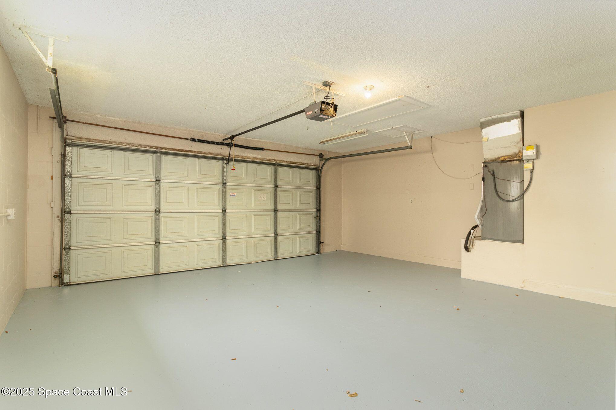2863 Corbusier Drive Melbourne, FL 32935 - Photo 18 of 20 a view of a garage