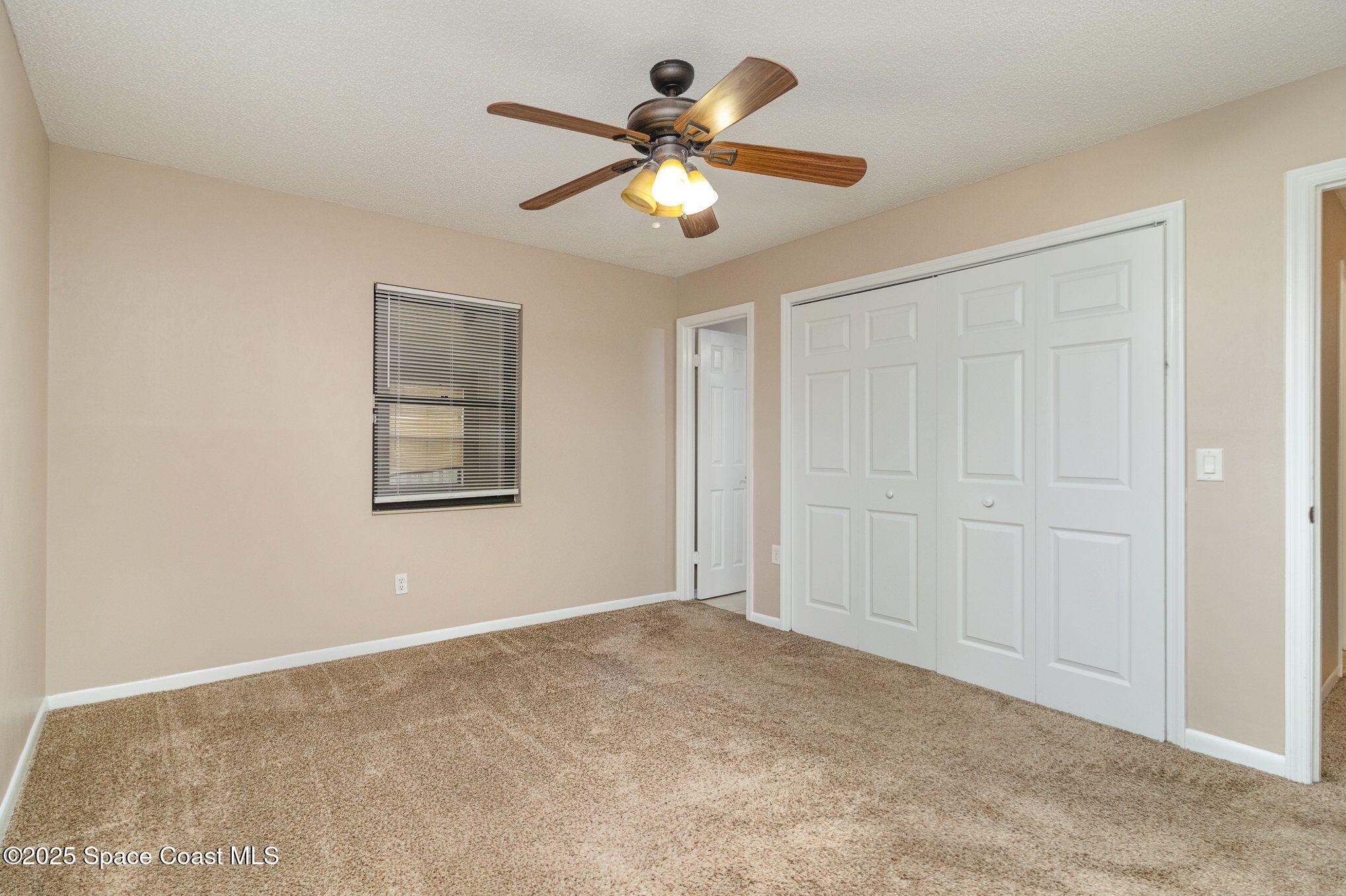 2863 Corbusier Drive Melbourne, FL 32935 - Photo 10 of 20 a view of an empty room with a window