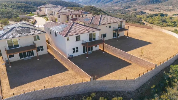 an aerial view of a house with swimming pool