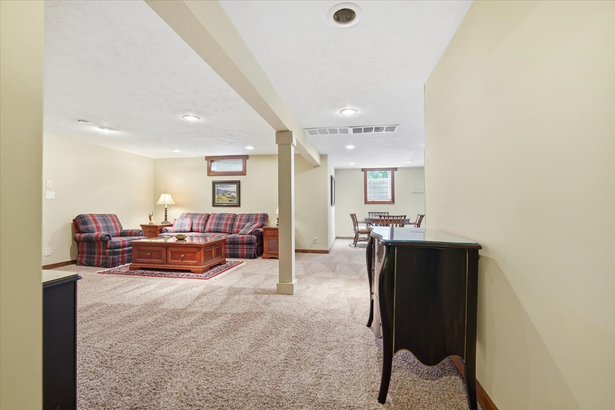 203 Highview Drive Eureka, IL 61530 - Photo 32 of 49 a living room with furniture and a flat screen tv