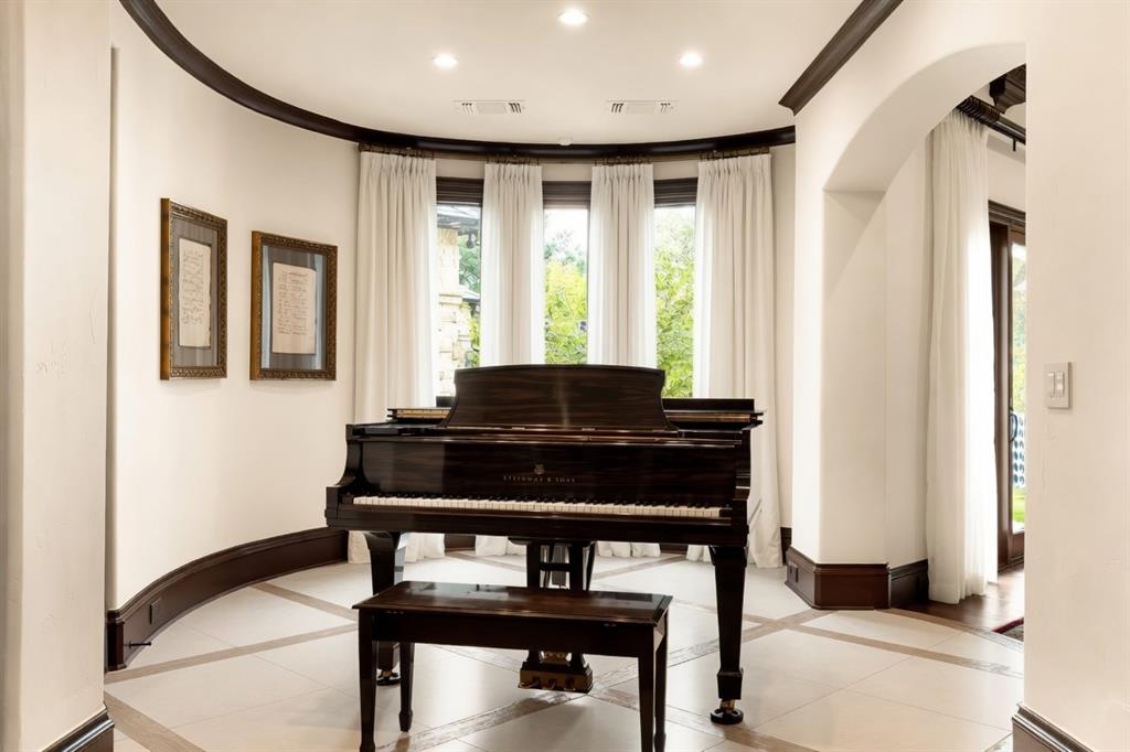 6413 Old Gate Road Plano, TX 75024 - Photo 23 of 39 a living room with furniture and a piano