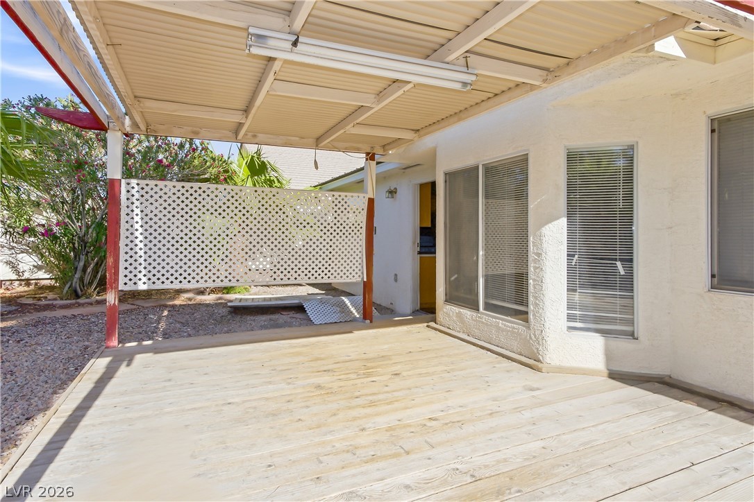 5100 Rancher Avenue Las Vegas, NV 89108 - Photo 15 of 26 A private outdoor patio with a sturdy wood deck provides an ideal space for relaxation and enjoyment.