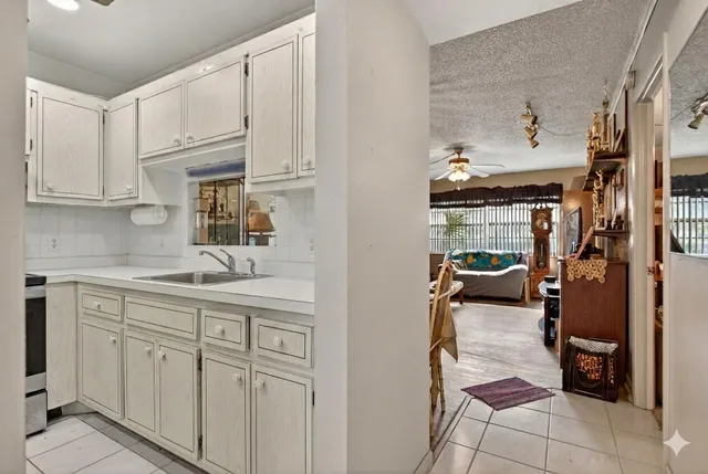 a view of a hallway with wooden shelves