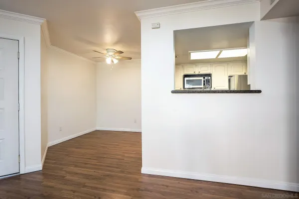 a kitchen with granite countertop a sink stainless steel appliances and cabinets