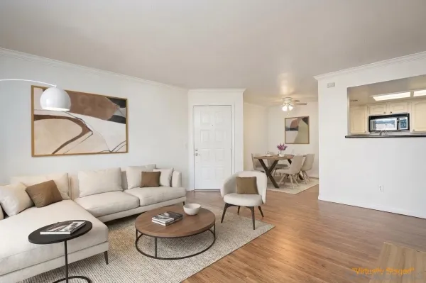 a kitchen with granite countertop a refrigerator and a stove top oven