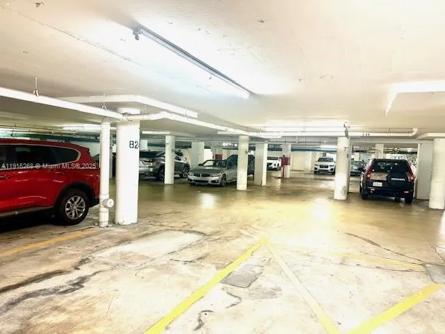 a bathroom with a glass door shower and a sink