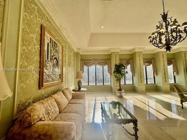 a view of a living room and chandelier