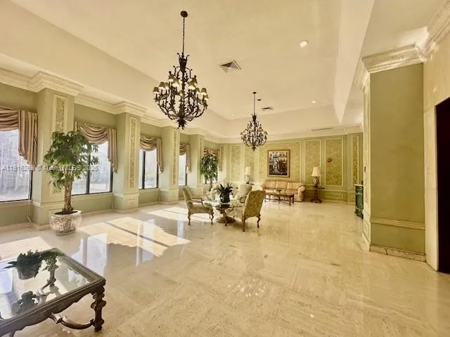 a living room with furniture chandelier and a chandelier