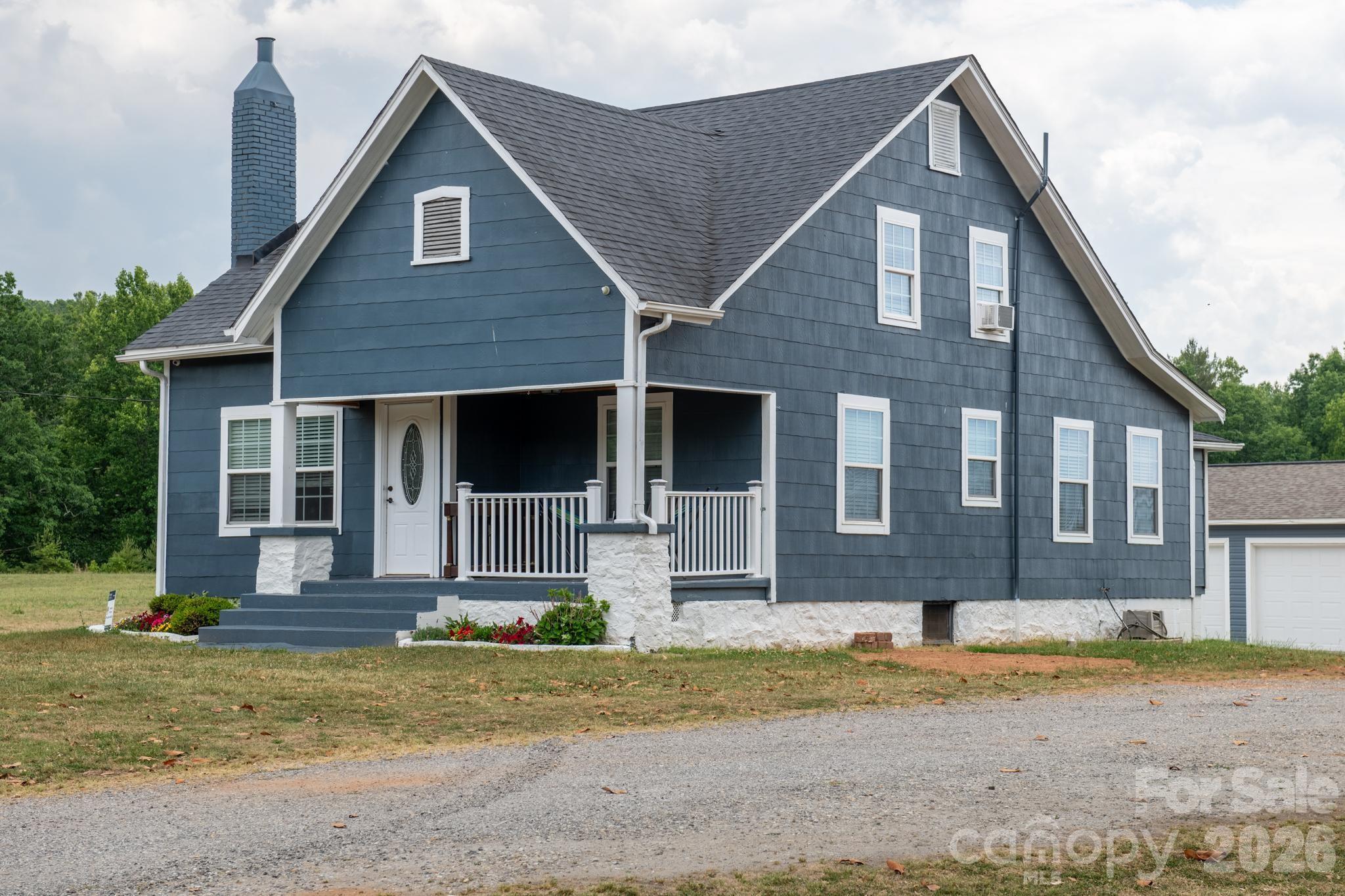 2076 Connelly Springs Road Lenoir, NC 28645 - Photo 39 of 47 a front view of a house with a yard