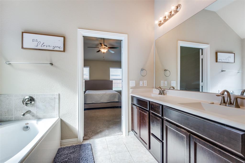 16621 Toledo Bend Court Prosper, TX 75078 - Photo 17 of 25 a en suite spacious bathroom with a tub sink and mirror