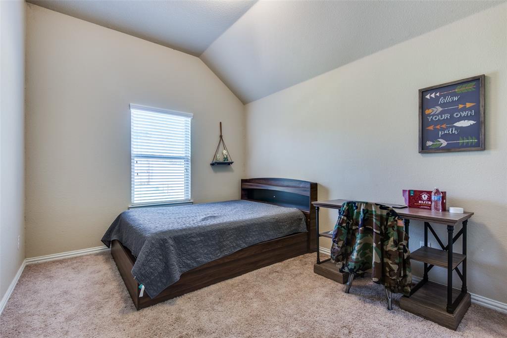 16621 Toledo Bend Court Prosper, TX 75078 - Photo 19 of 25 a bedroom with a bed a desk and chair