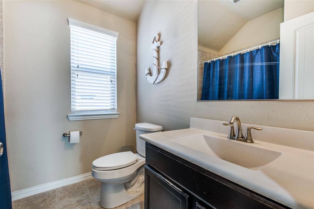 16621 Toledo Bend Court Prosper, TX 75078 - Photo 20 of 25 a bathroom with a sink a toilet and a window