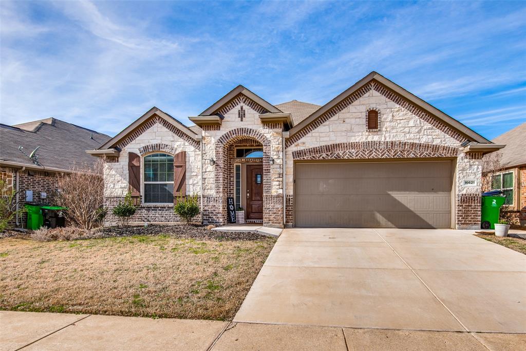 16621 Toledo Bend Court Prosper, TX 75078 - Photo 2 of 25 a front view of a house with yard and garage