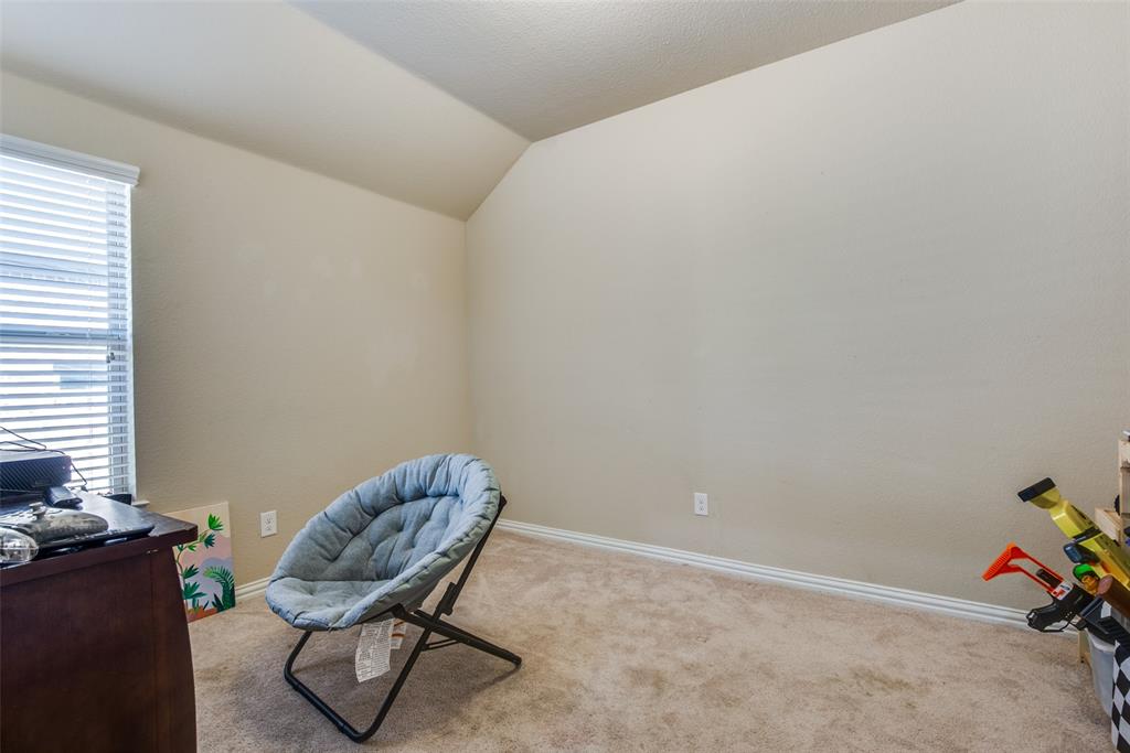 16621 Toledo Bend Court Prosper, TX 75078 - Photo 21 of 25 a living room with furniture and a window