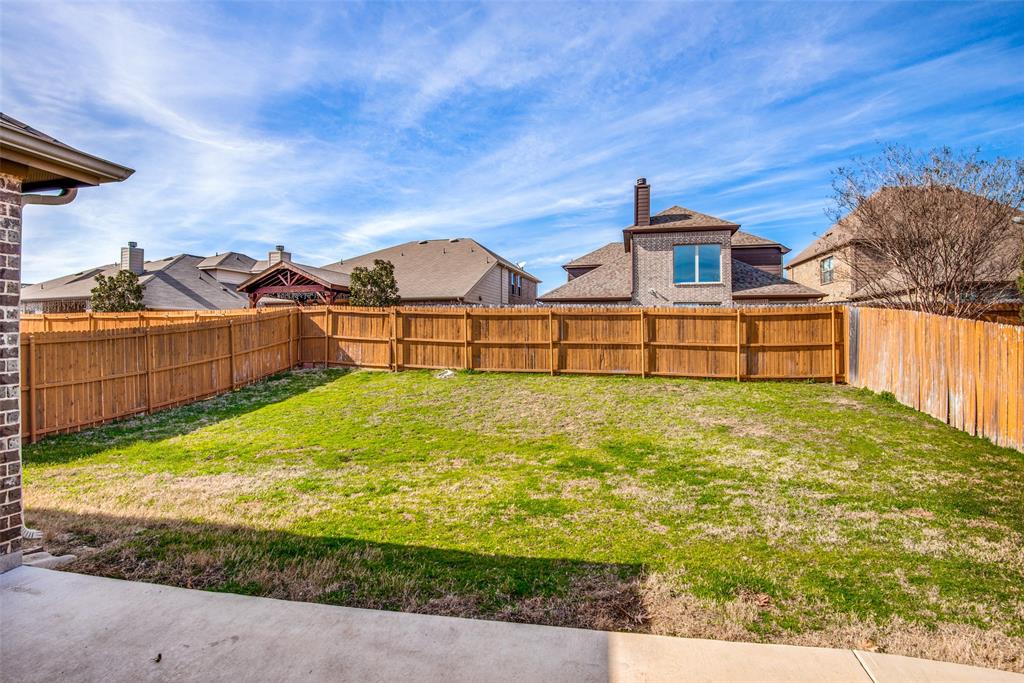 16621 Toledo Bend Court Prosper, TX 75078 - Photo 23 of 25 a view of a yard with wooden fence