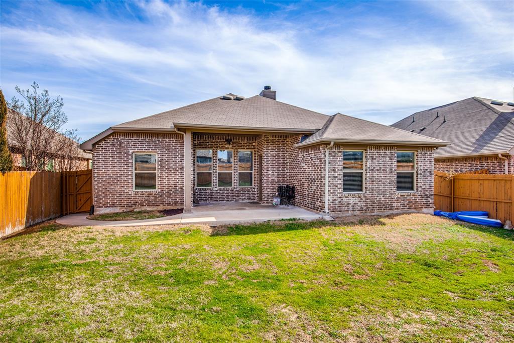 16621 Toledo Bend Court Prosper, TX 75078 - Photo 24 of 25 a view of a house with a swimming pool and a yard
