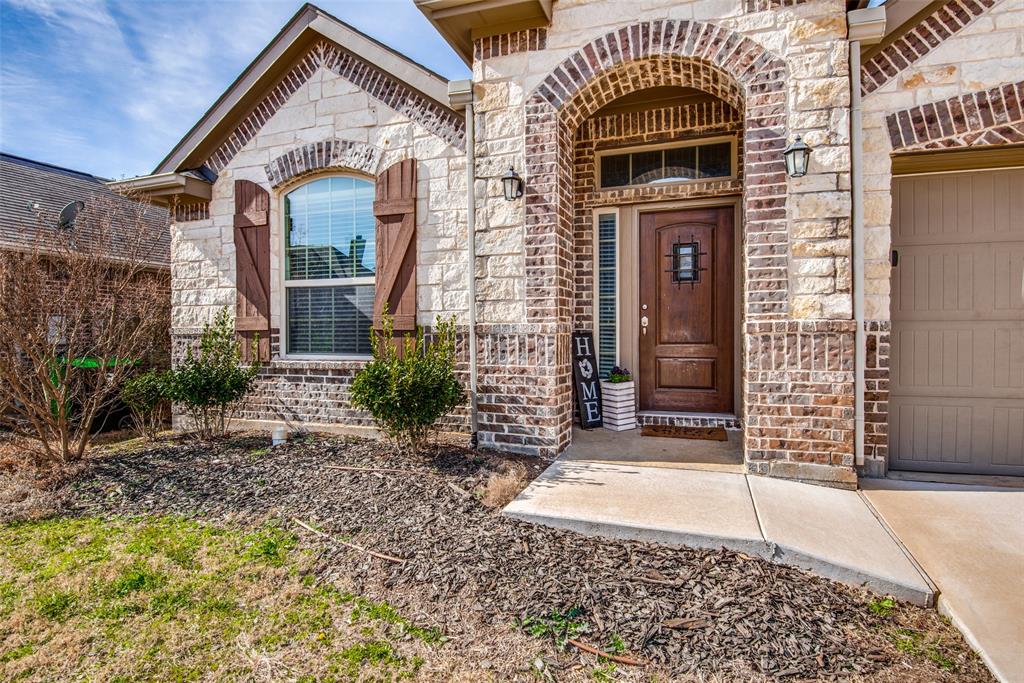 16621 Toledo Bend Court Prosper, TX 75078 - Photo 4 of 25 a front view of a house with a garden