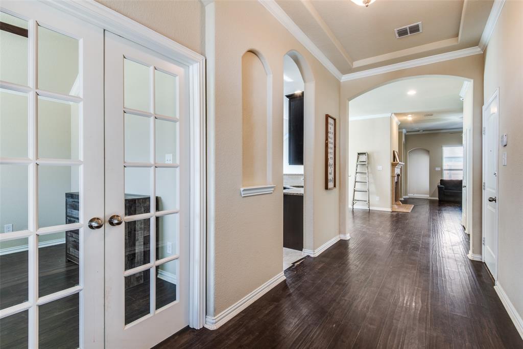 16621 Toledo Bend Court Prosper, TX 75078 - Photo 6 of 25 a view of a hallway with wooden floor and staircase