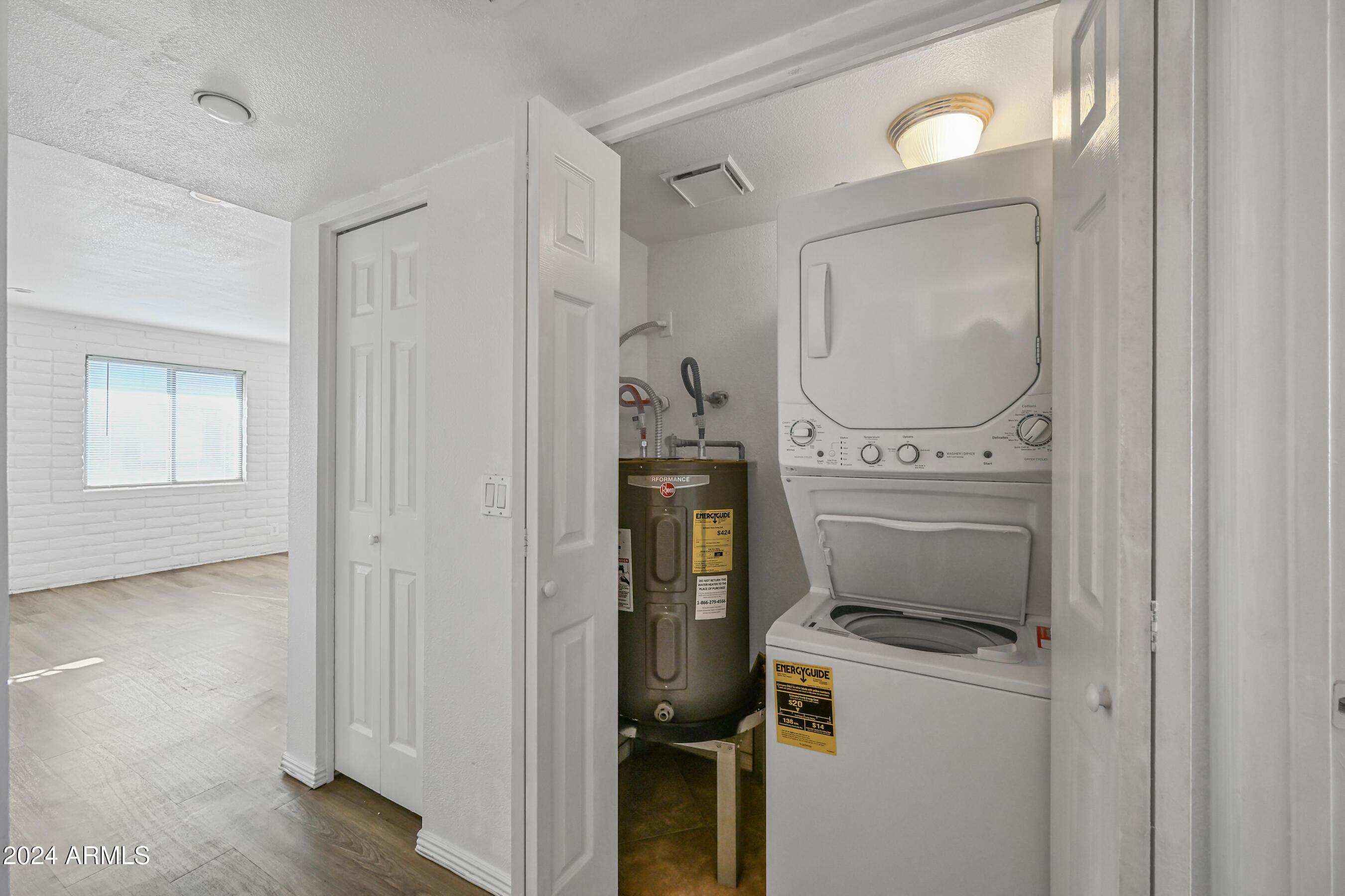 1234 North 36th Street, Unit 209 Phoenix, AZ 85008 - Photo 14 of 15 a view of washer and dryer with bathroom in the background