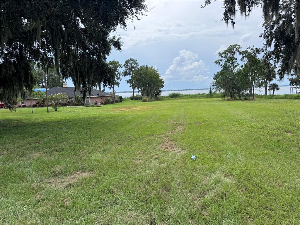 S Lake Frostproof, FL 33843 - Photo 9 of 13 a view of outdoor space with green field and trees