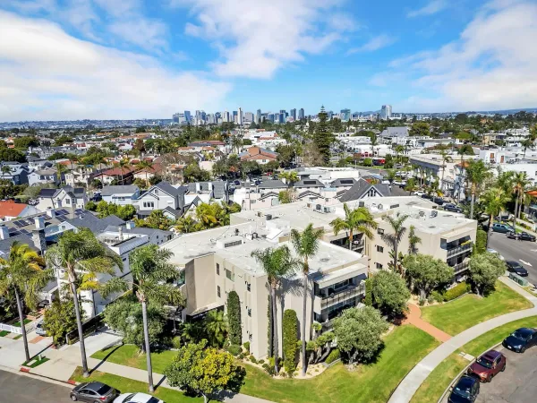 an aerial view of residential houses with outdoor space